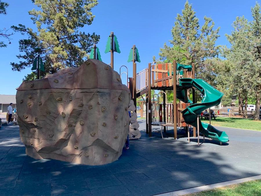 Sisters Village Green Park rock wall and playground