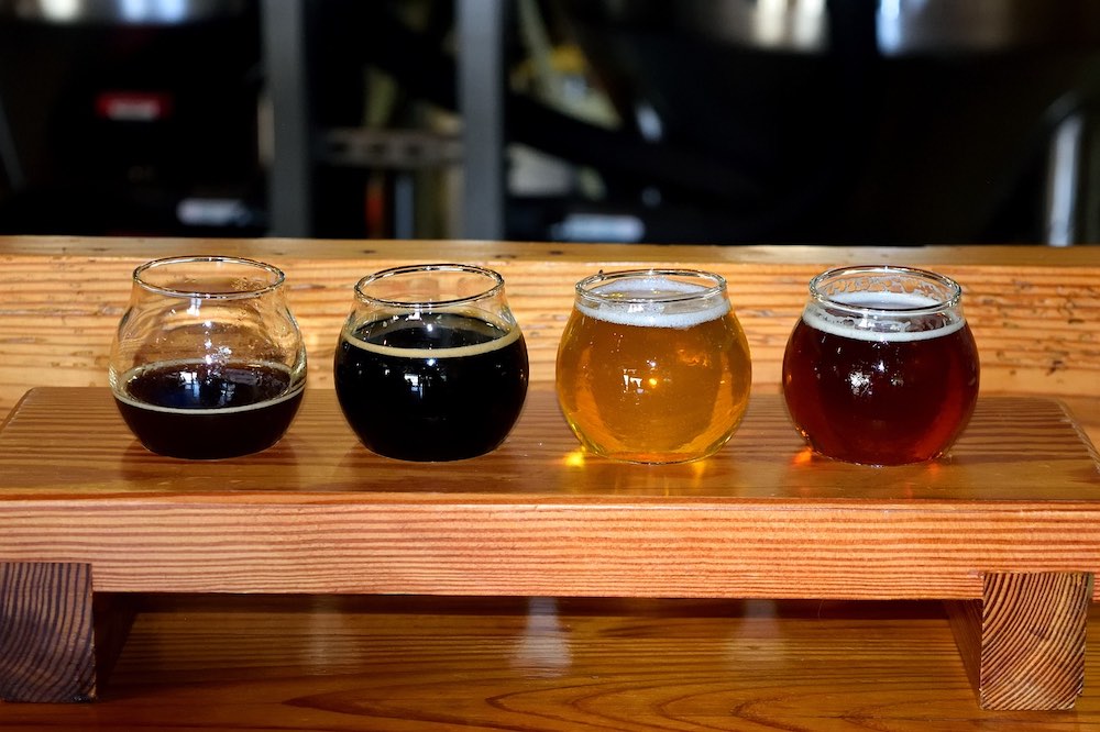 beer tasting flight on wood table